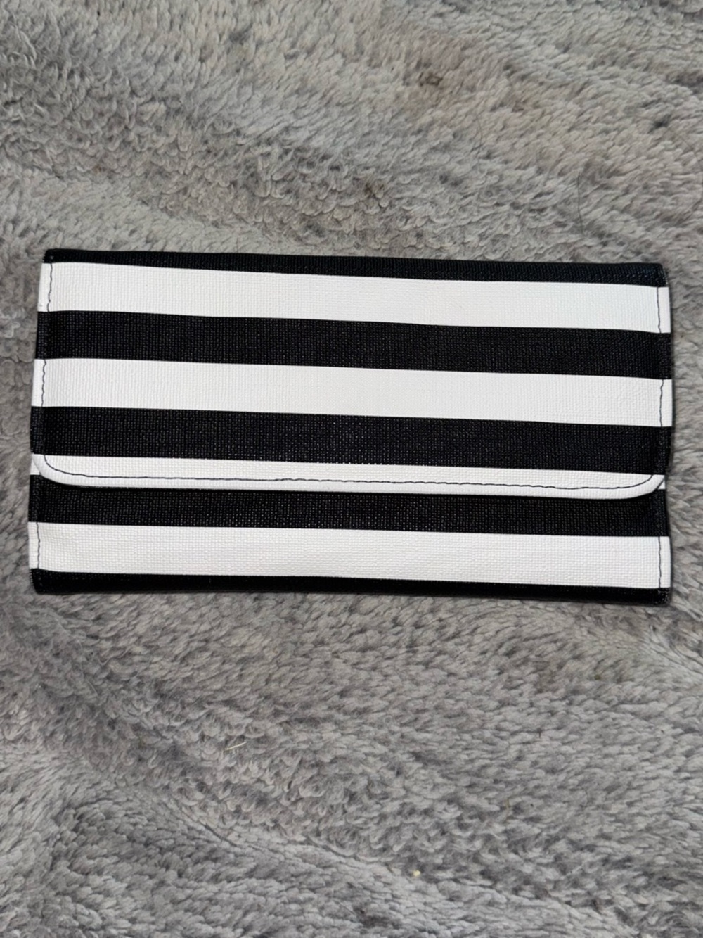 Kut from the Kloth slim striped wallet is made of black and white vegan leather